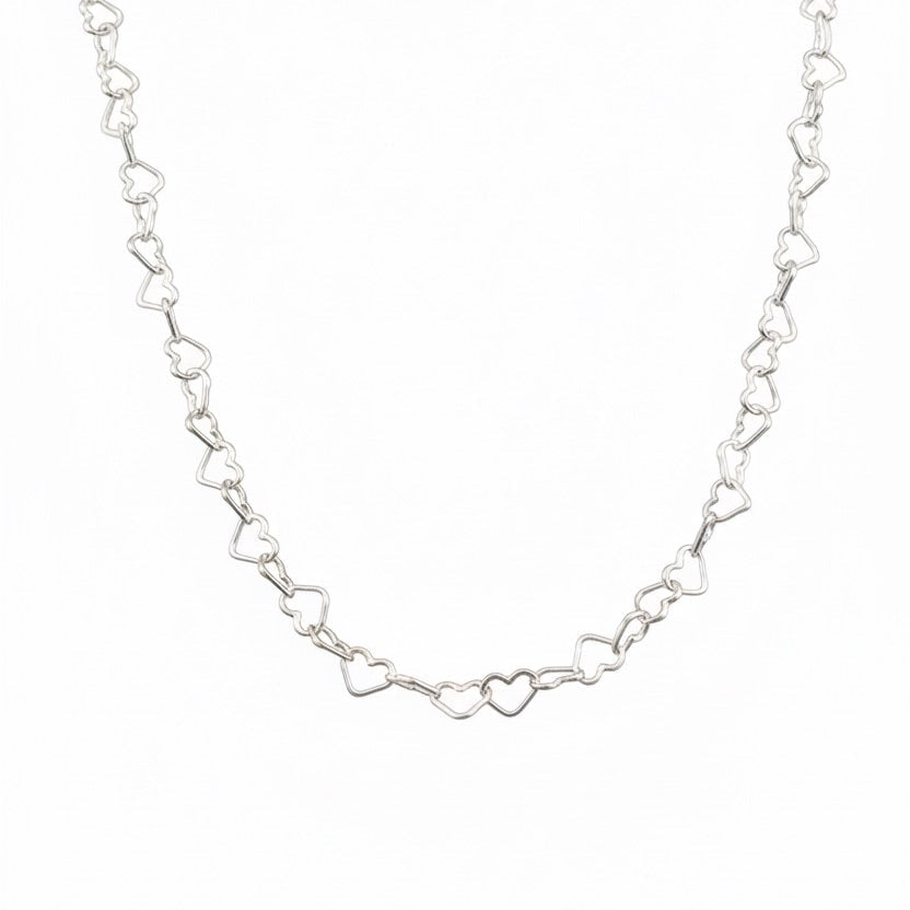 Cadena Cuori Intrecciati de plata italiana 925. Diseño de corazones entrelazados unos con otros
Línea Essenziale Di Vogel